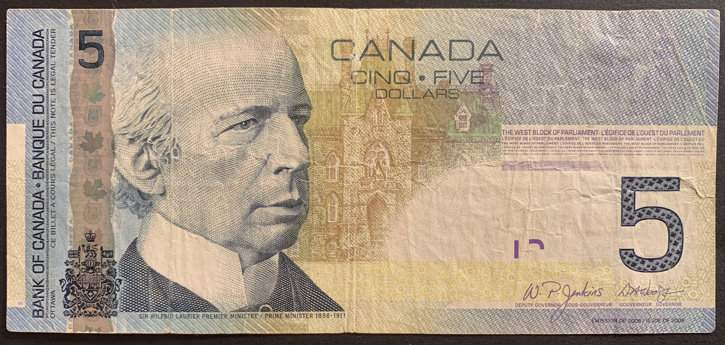 Canada 5 Dollars 2006 P-101Aa banknote bill with portrait of Sir Henry Charles Wilfrid Laurier and West Block of the Parliament Buildings in Ottawa