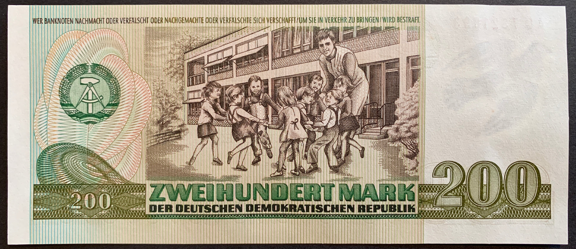 Germany, GDR 200 Mark 1985 P-32 UNC vintage banknote with teacher playing with schoolchildren