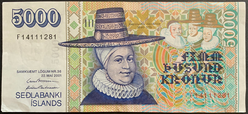 Obverse of the Iceland 5000 Krónur 2001 banknote featuring a detailed portrait of Ragnheiður Jónsdóttir on the left side. The background displays intricate Icelandic patterns and fine linework in shades of purple and violet. Security features, including microprinting and watermark areas, are visible across the design. The denomination ‘5000’ appears prominently in multiple locations with clean, sharp color.