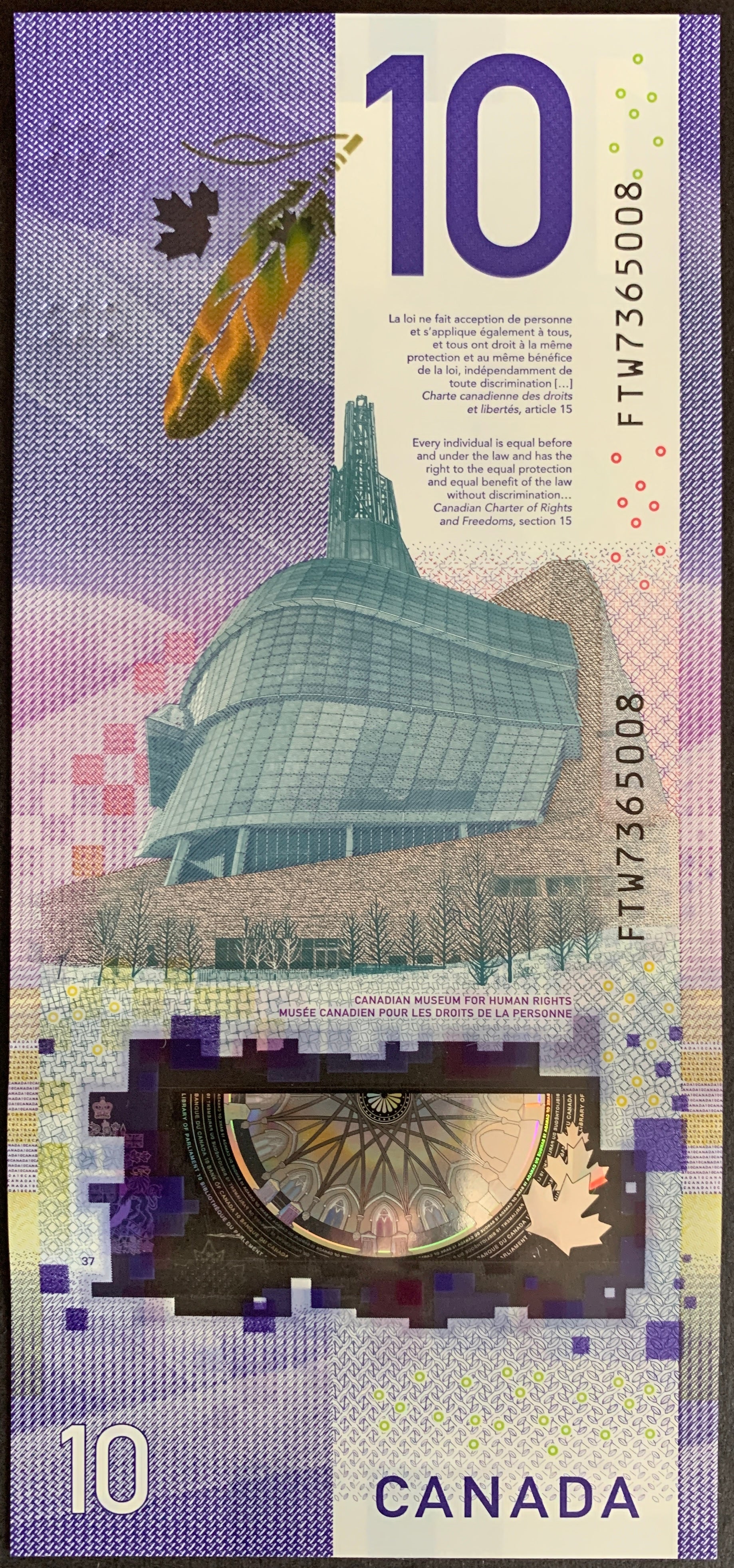 Back of the 2018 Canada 10 Dollar banknote (P-113a) showing the Canadian Museum for Human Rights with detailed polymer transparency features in UNC condition.