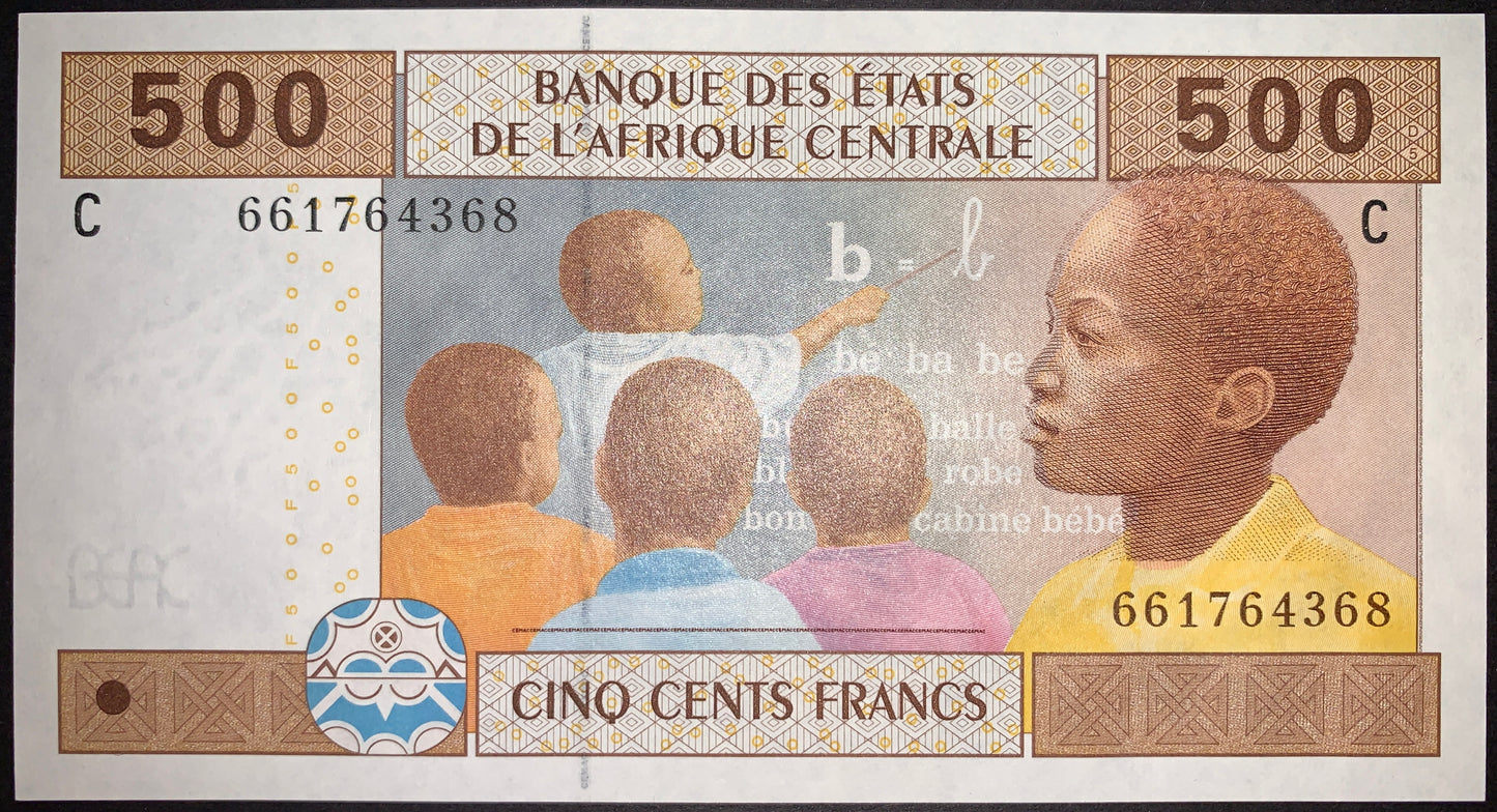 Obverse of the Central African States 500 Francs 2002 banknote (P-606Ca), showing a portrait of a young student and children in a classroom learning to read and write.