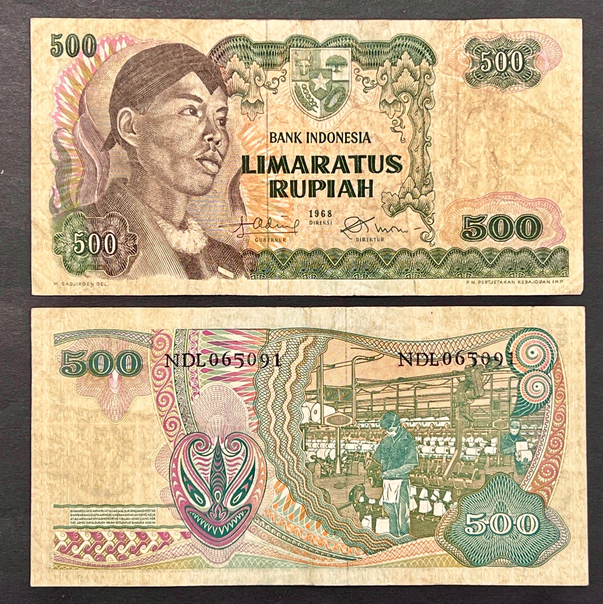 Front view of a vintage 1968 Indonesia 500 Rupiah banknote featuring a portrait of General Sudirman wearing a traditional headdress and the national emblem.