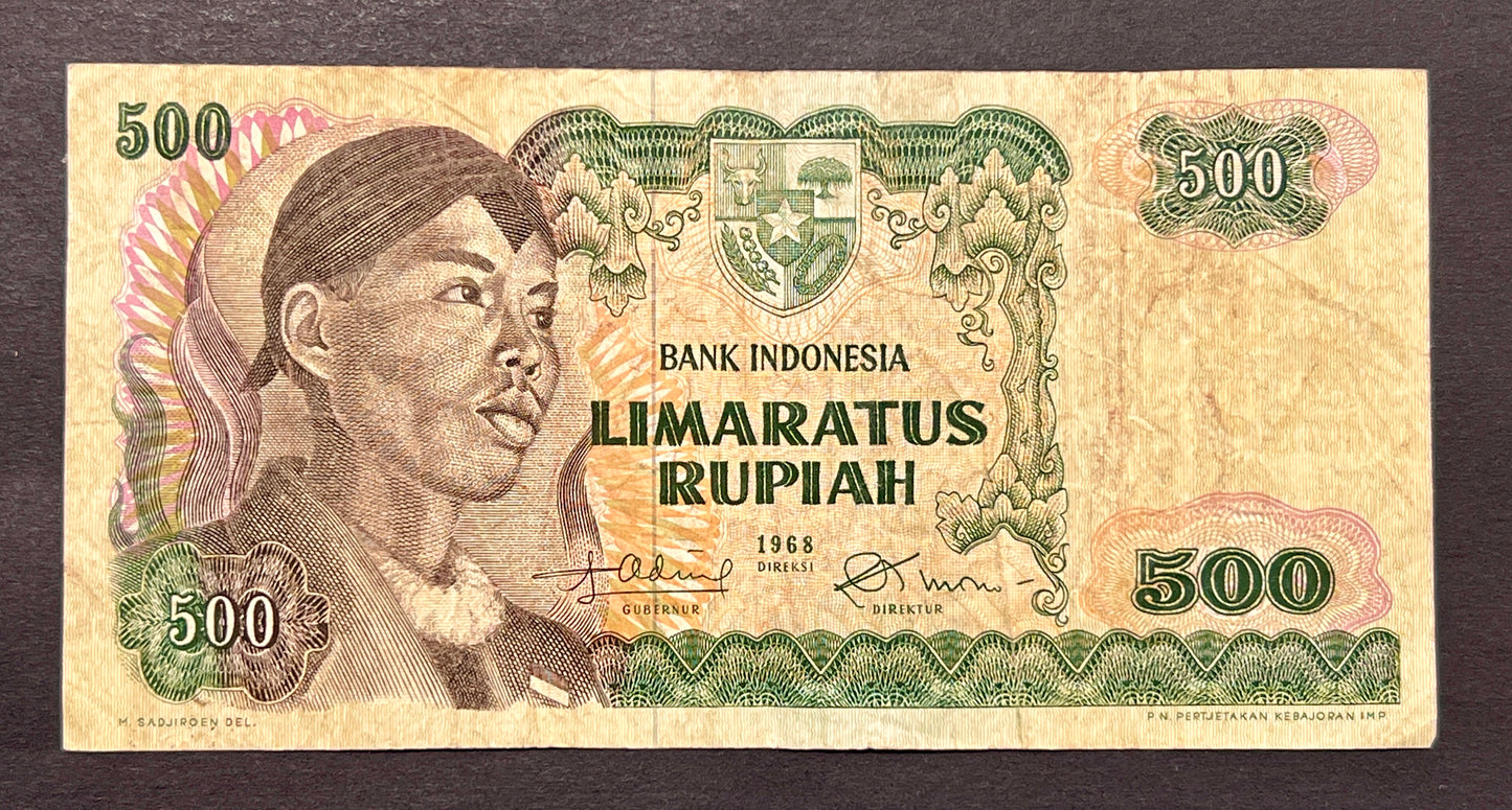 Front view of a vintage 1968 Indonesia 500 Rupiah banknote featuring a portrait of General Sudirman wearing a traditional headdress and the national emblem.