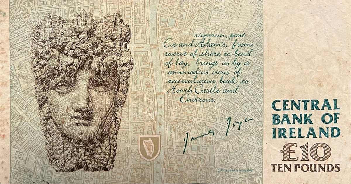 Back view of a 1994 Ireland 10 Pounds banknote showing the River Liffey head from the Custom House and the opening lines of Finnegans Wake over a map of Dublin.