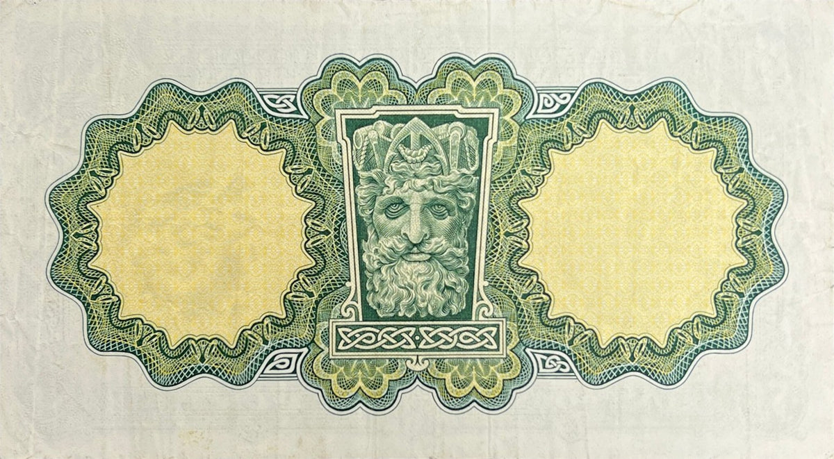 Back view of a 1972 Ireland 1 Pound banknote showing the river-god head from the Custom House in Dublin.