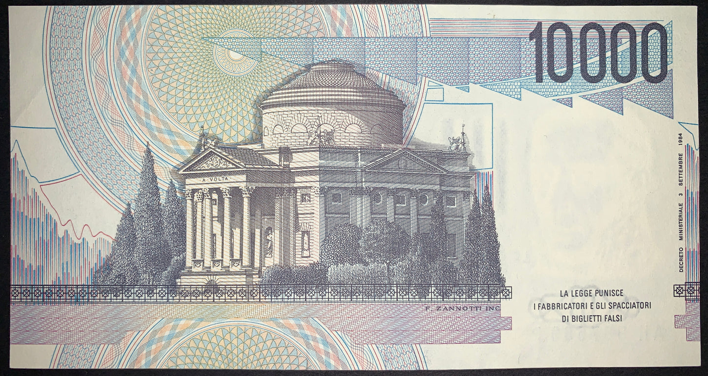 Italy 10,000 Lire 1984 P-112d AUNC banknote reverse depicting the Tempio Voltiano in Como with ornate guilloche patterns and the 10,000 Lire denomination.