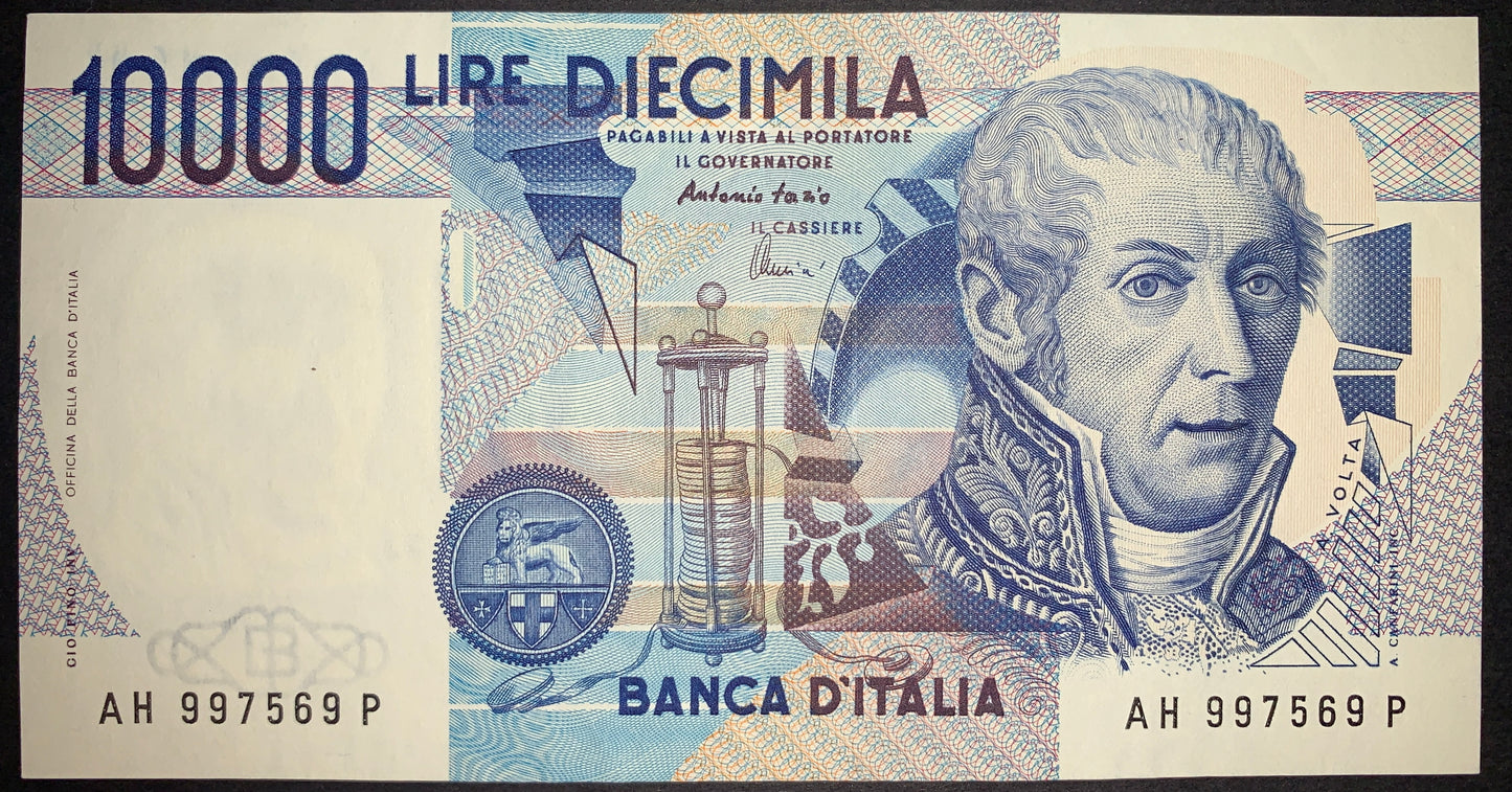 Italy 10,000 Lire 1984 P-112d AUNC banknote obverse featuring Alessandro Volta, an electrostatic generator, the Lion of Saint Mark medallion, and intricate geometric security patterns.
