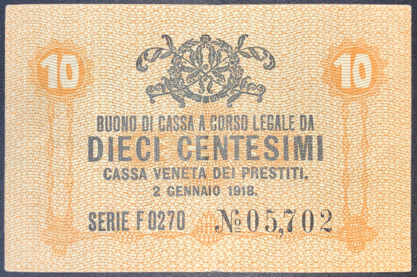 front of Italy 10 Centesimi 1918 P-M2 collectible vintage european small yellow banknote