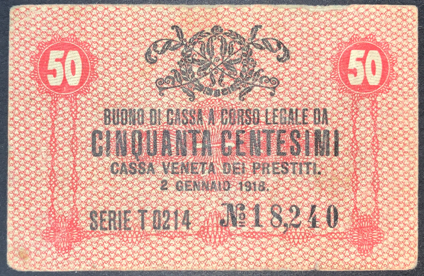 front of Italy 50 Centesimi 1918 P-M3 collectible vintage european small red banknote