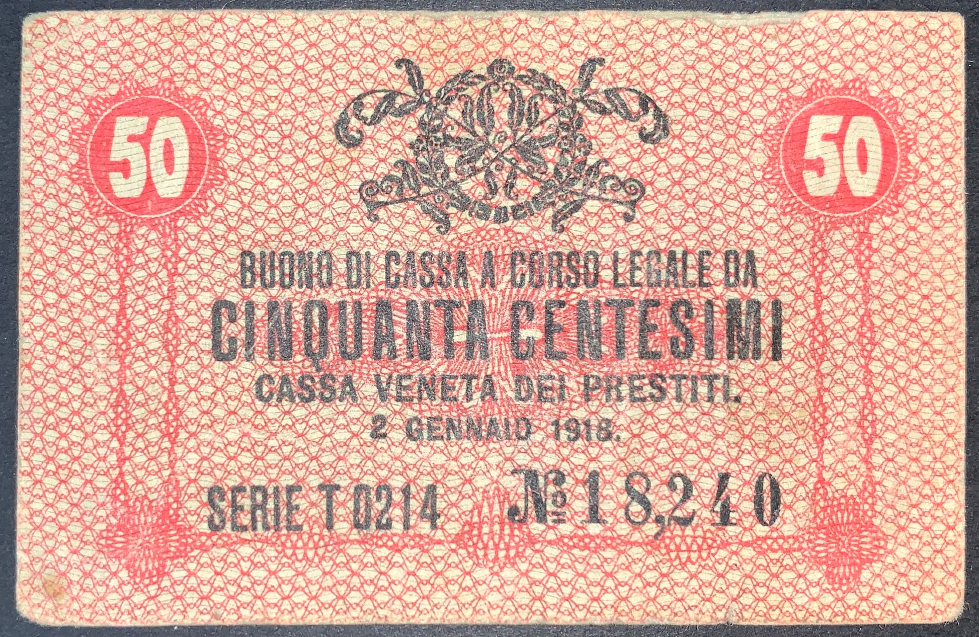 front of Italy 50 Centesimi 1918 P-M3 collectible vintage european small red banknote
