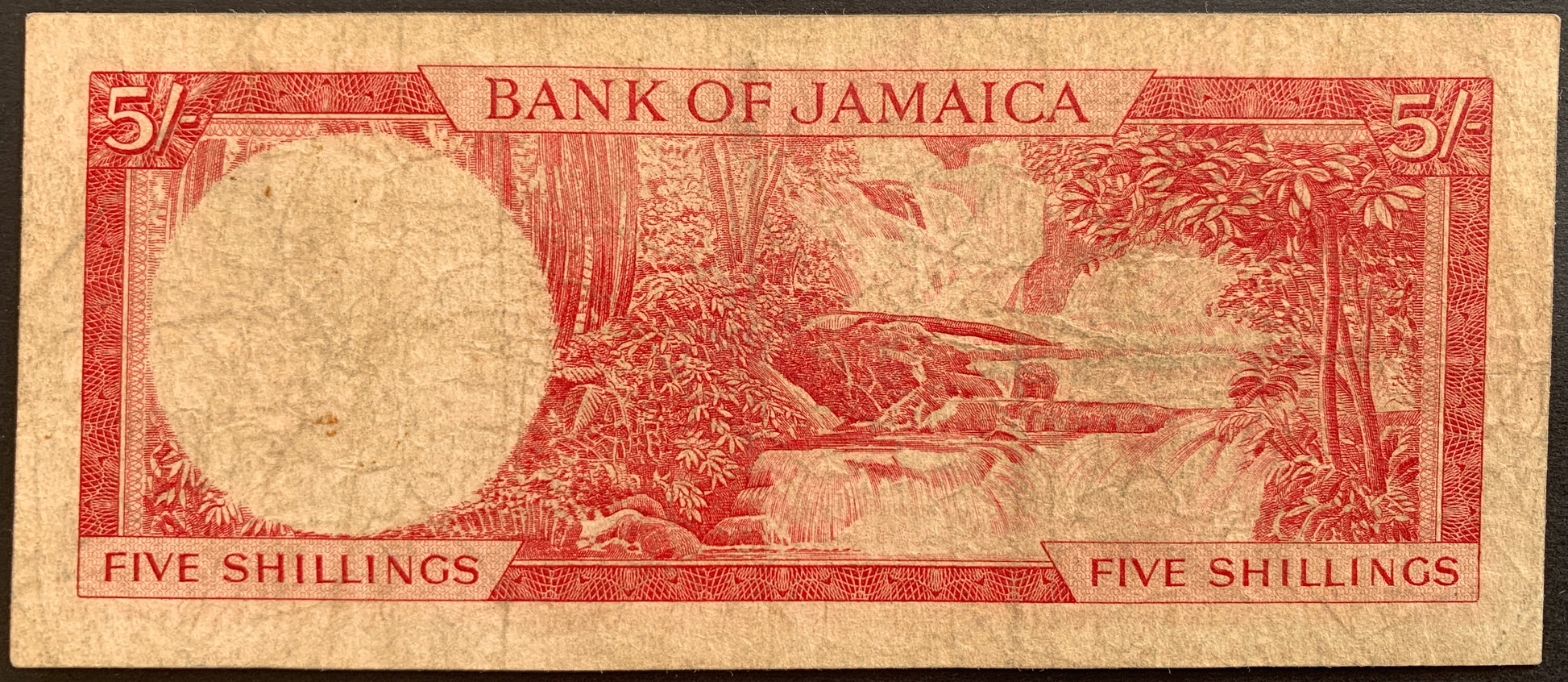 back of Jamaica 5 Shillings 1964 P-51Aa F+ vintage banknote with Dunn's River falls