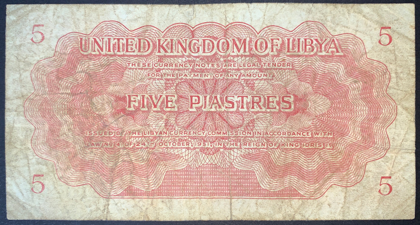 Reverse of Libya 5 Piastres banknote P-5a featuring "United Kingdom of Libya" and "Five Piastres" in English, surrounded by an elaborate guilloche security design with denomination numerals in each corner. Authentic collectible Libyan paper money from the Kingdom of Libya era.