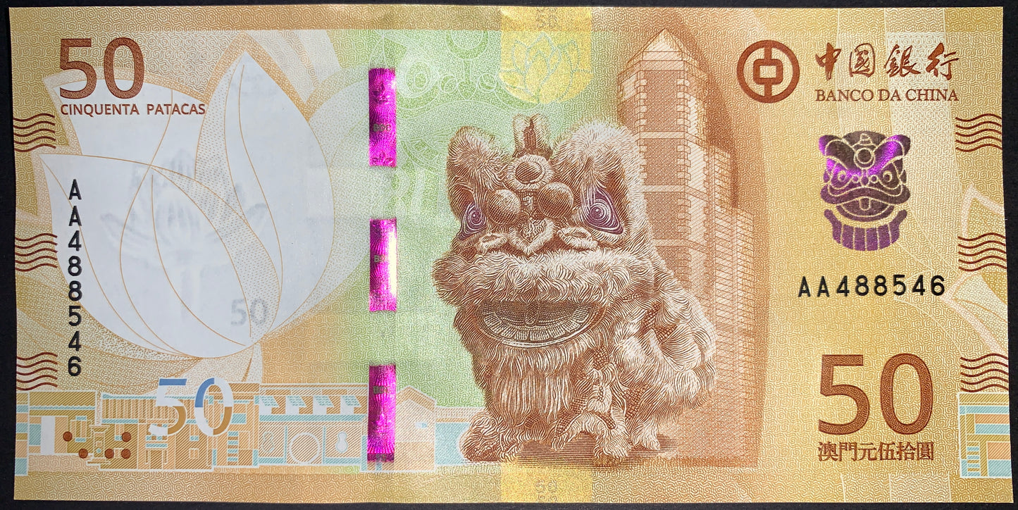 front of Macau 50 Patacas 2020 collectible modern banknote with Bank of China headquarters in Macau, traditional buildings, and a performer in a dragon dance costume