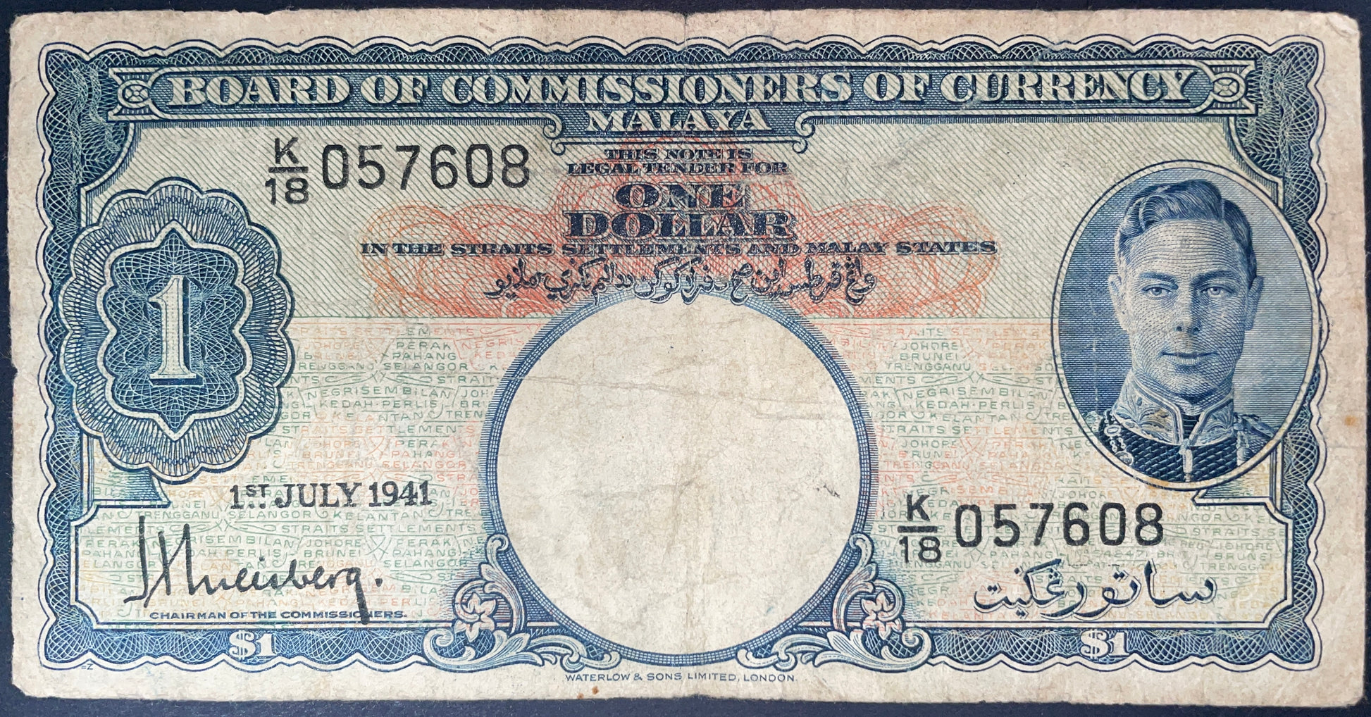 Front of 1941 Malaya 1 Dollar banknote featuring King George VI portrait, serial number K/18 057608, and July 1, 1941 date