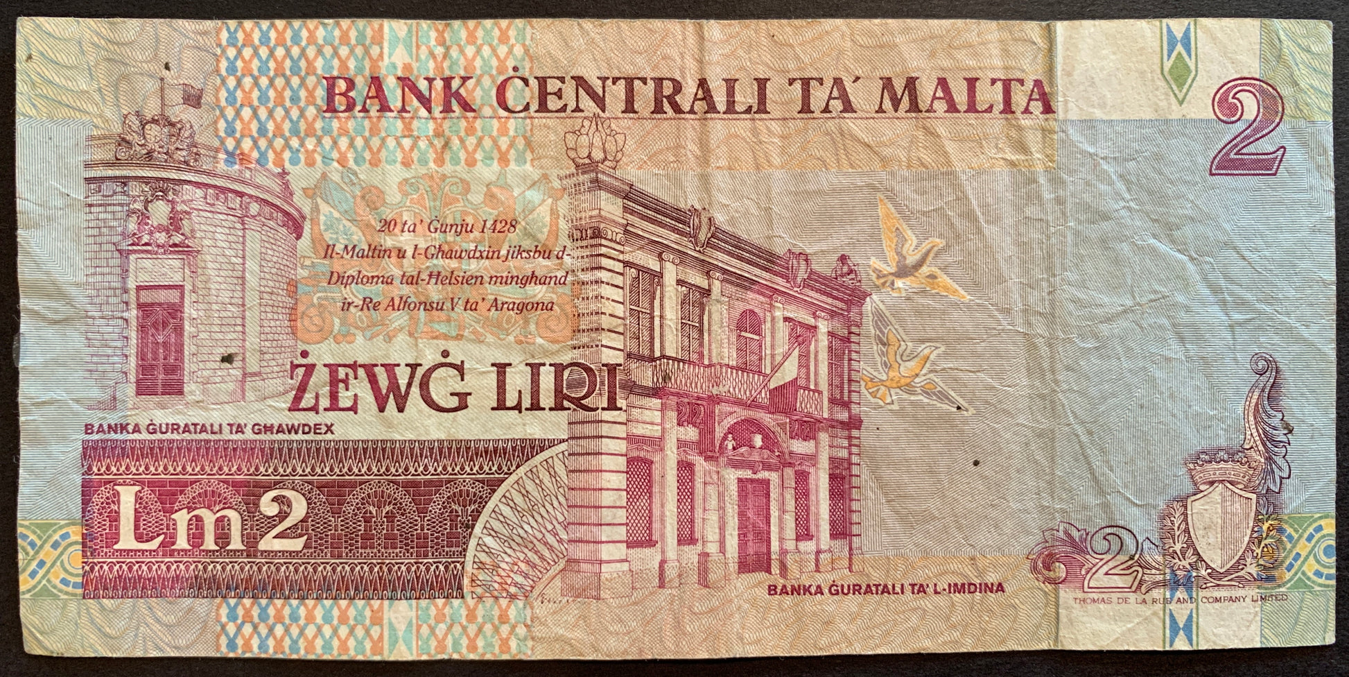 Malta 2 Liri ND (1999-2007) P-45d F+ collectible pre-euro banknote with Bank buildings in Għawdex (Gozo) and Mdina and Decree of King Alfonso V of Aragon