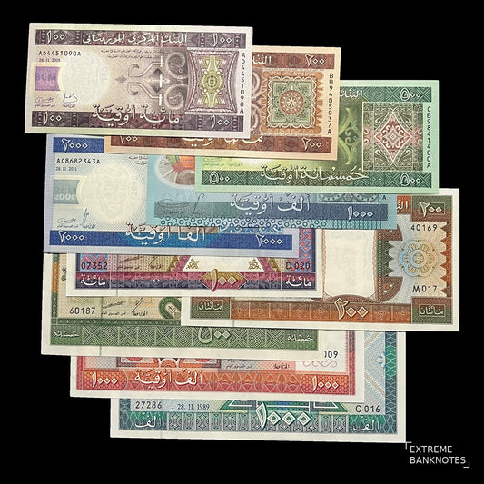 Front view of ten uncirculated Mauritania Ouguiya banknotes from 100 to 2000 Ouguiya with Arabic lettering and geometric ornament.