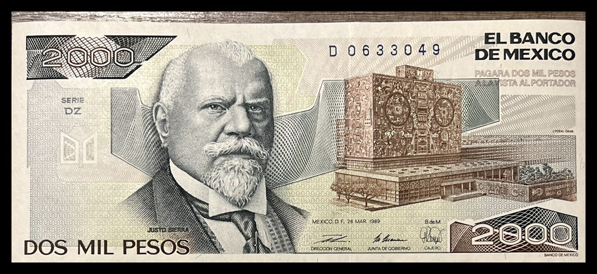 Front view of a nearly uncirculated 1989 Mexico 2000 Pesos banknote featuring Justo Sierra and the mosaic-covered UNAM Central Library.