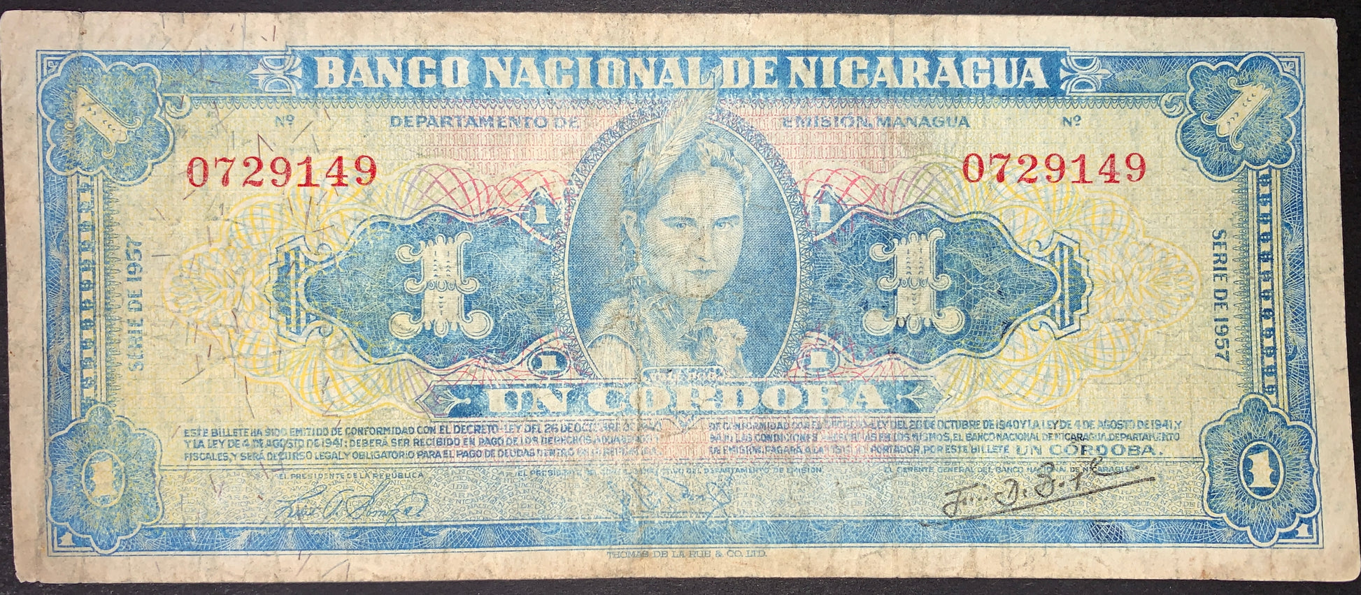 Nicaragua 1 Córdoba 1957 P-99b banknote front showing indigenous woman portrait, Banco Nacional de Nicaragua title, red serial numbers, and ornate blue engraved design