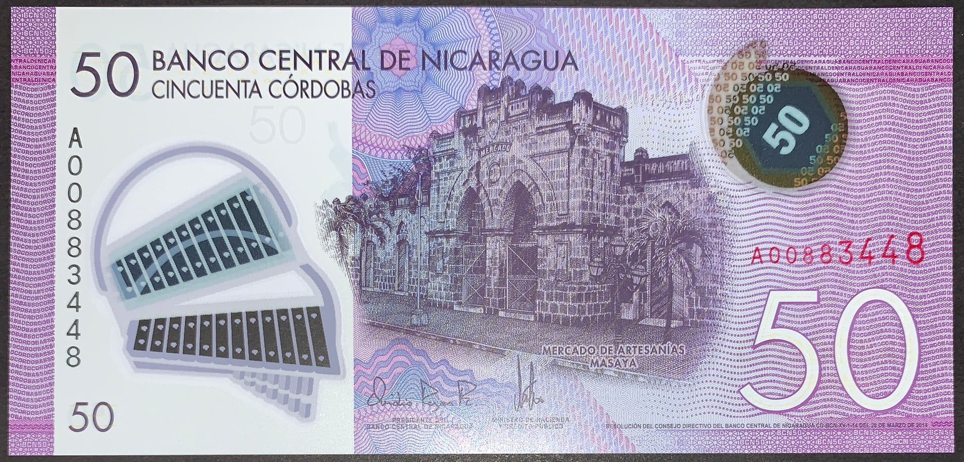 Nicaragua 50 Córdobas 2014 P-211a UNC polymer banknote front showing Mercado de Artesanías Masaya, transparent security window, holographic feature and purple banknote design