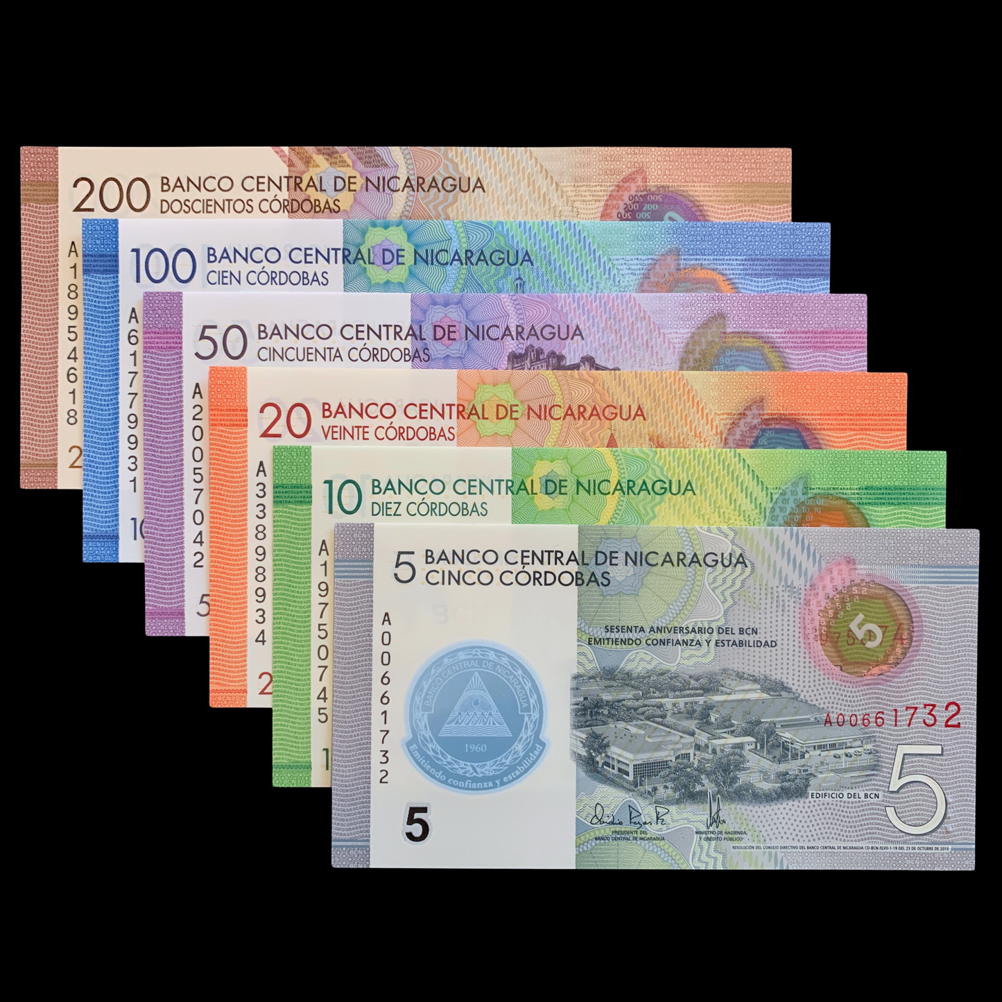 Set of colorful Nicaraguan polymer banknotes from 5 to 200 Córdobas on a black background.