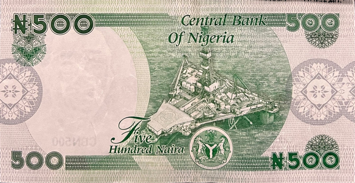 Back view of a 2025 Nigeria 500 Naira banknote showing an offshore oil rig platform and the Nigerian coat of arms.