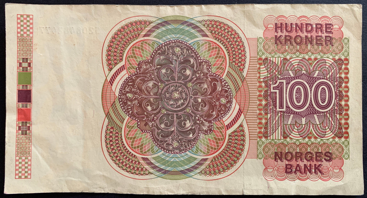 Back of the 1986 Norway 100 Kroner banknote (P-43c) displaying Norwegian cultural and historical motifs with fine engraved details, shown in VF condition.