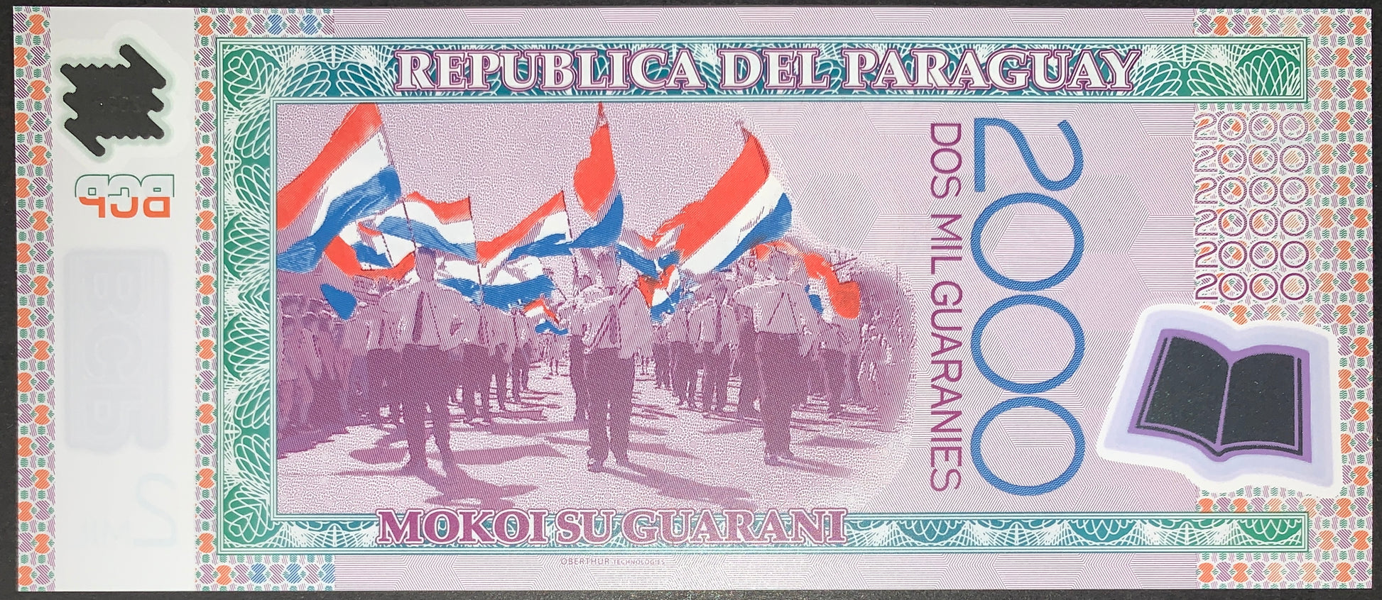 back of Paraguay 2000 Guaranies 2008 P-228a UNC Polymer collectible modern banknote with people holding national flag
