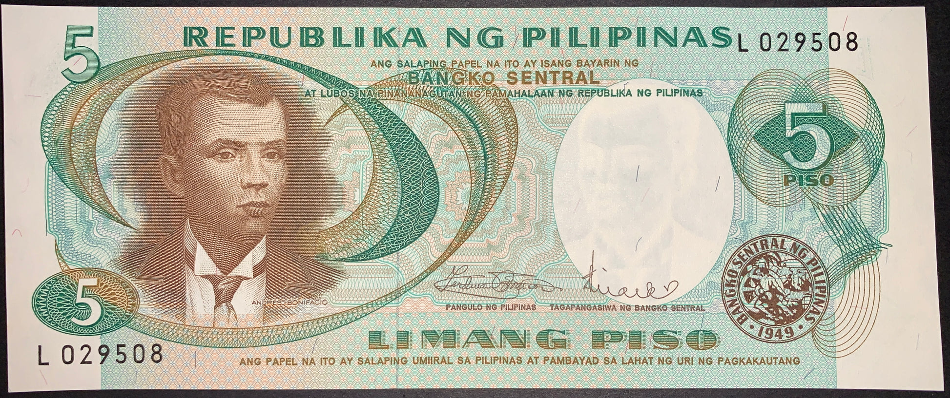 "Front of Philippines 5 Piso banknote showing Andres Bonifacio portrait, Banco Sentral seal, serial number L029508, and intricate green guilloche security patterns."