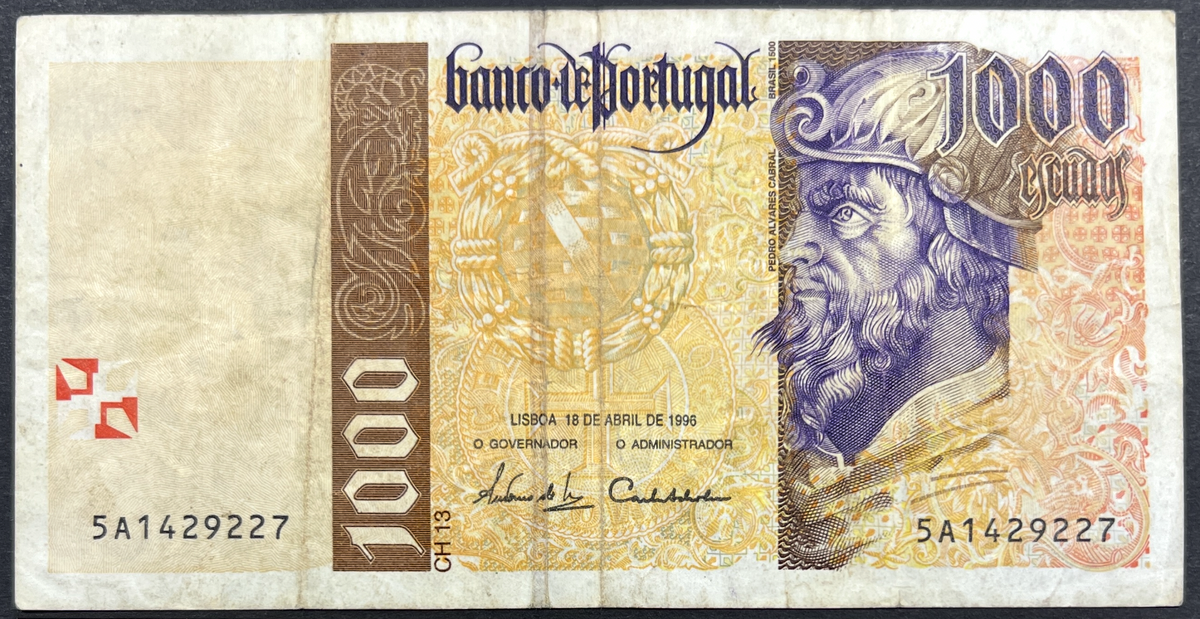 Front view of a circulated 1996 Portugal 1000 Escudos banknote featuring a portrait of explorer Pedro Alvares Cabral and the Cross of the Order of Christ.
