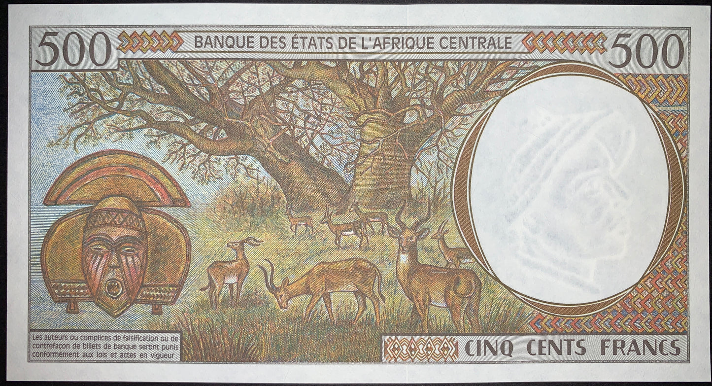 Reverse of the Republic of the Congo 500 Francs 2000 P-101Cg UNC banknote featuring a majestic baobab tree, antelopes on the African savannah, a carved Kota tribal mask, and an antelope-head watermark. Authentic collectible currency.