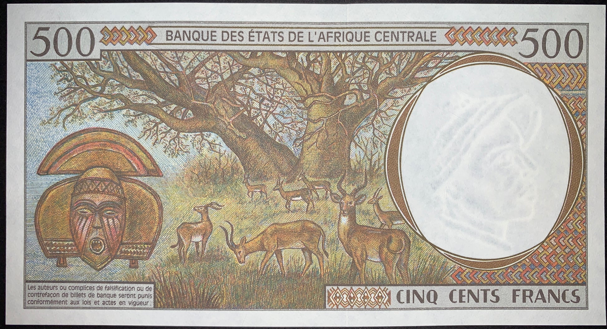 Reverse of the Republic of the Congo 500 Francs 2000 P-101Cg UNC banknote featuring a majestic baobab tree, antelopes on the African savannah, a carved Kota tribal mask, and an antelope-head watermark. Authentic collectible currency.
