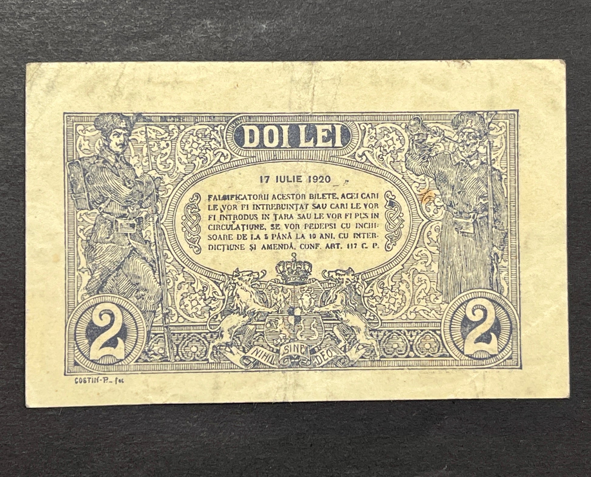 Back view of a 1920 Romania 2 Lei banknote showcasing two World War I era Romanian soldiers and the royal coat of arms.