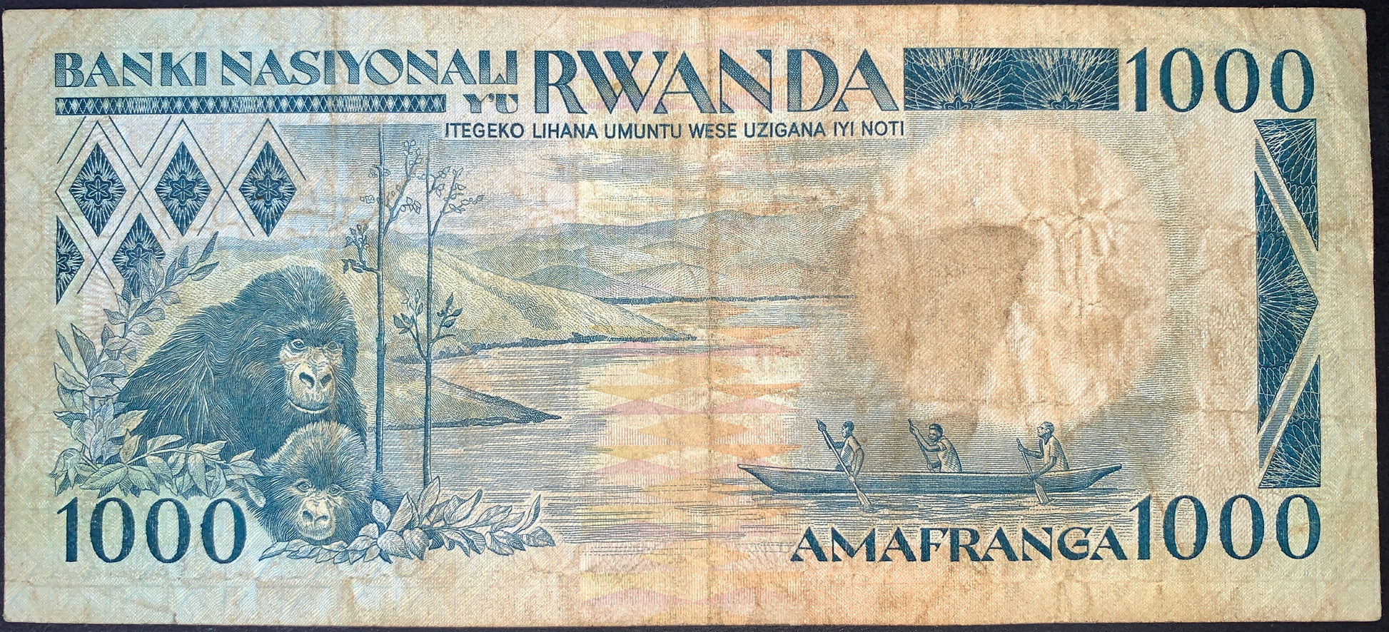 back of Rwanda 1000 Francs 1981 P-17 F collectible vintage banknote with gorillas and fishermen in boat