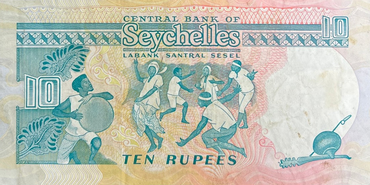 Back view of a 1989 Seychelles 10 Rupees banknote showing islanders dancing to a drummer and a traditional musical bow.