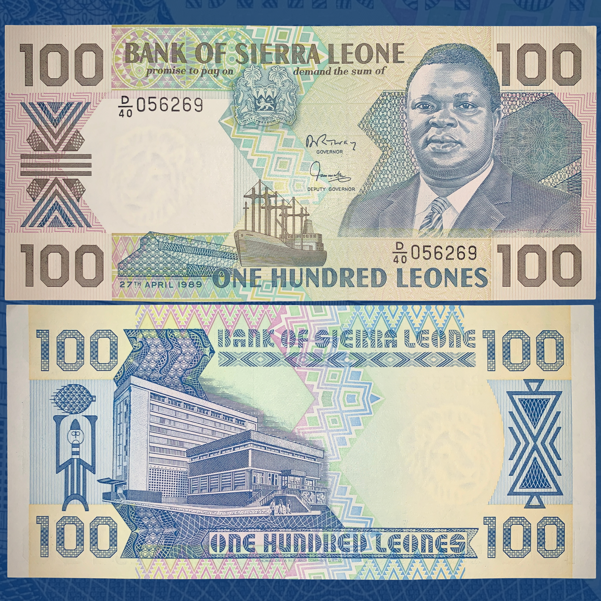 Front and back of Sierra Leone 100 Leones banknote P-18b dated 27 April 1989. The obverse features a portrait of President Joseph Saidu Momoh, the national coat of arms, a cargo ship, geometric security patterns, and multicolored engravings in blue, green, and pink. The reverse depicts the Bank of Sierra Leone headquarters with decorative motifs, large "100" denominations, and intricate guilloche designs. Crisp uncirculated world banknote shown in full.
