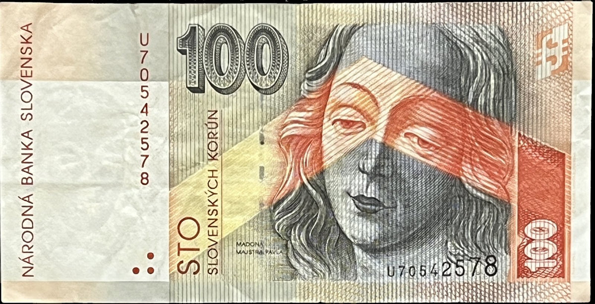 Front view of a circulated 2001 Slovakia 100 Korún banknote featuring the Gothic Madonna carved by Master Paul of Levoča, crossed by a bold orange band.