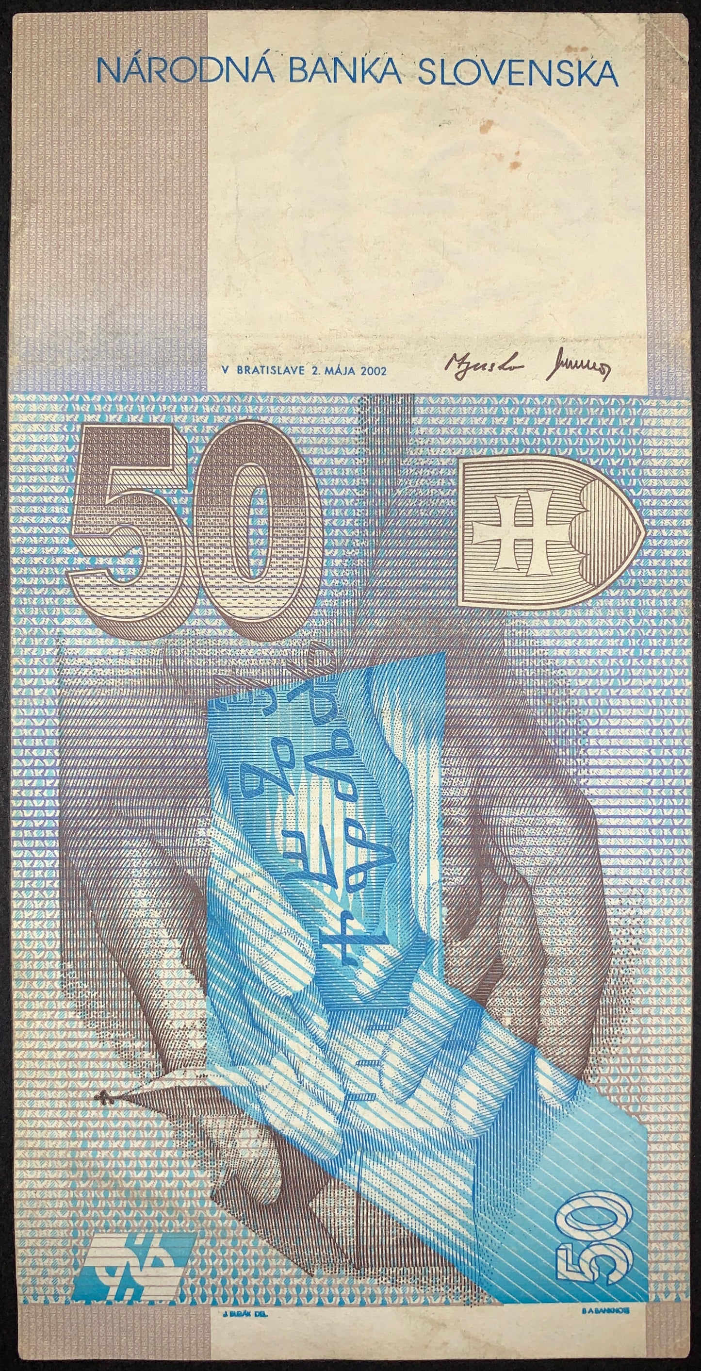 Reverse of the Slovak 50 korún note displaying religious symbolism and historical artwork associated with Saints Cyril and Methodius. Includes ornate patterns, denomination markings, and official National Bank of Slovakia design elements.