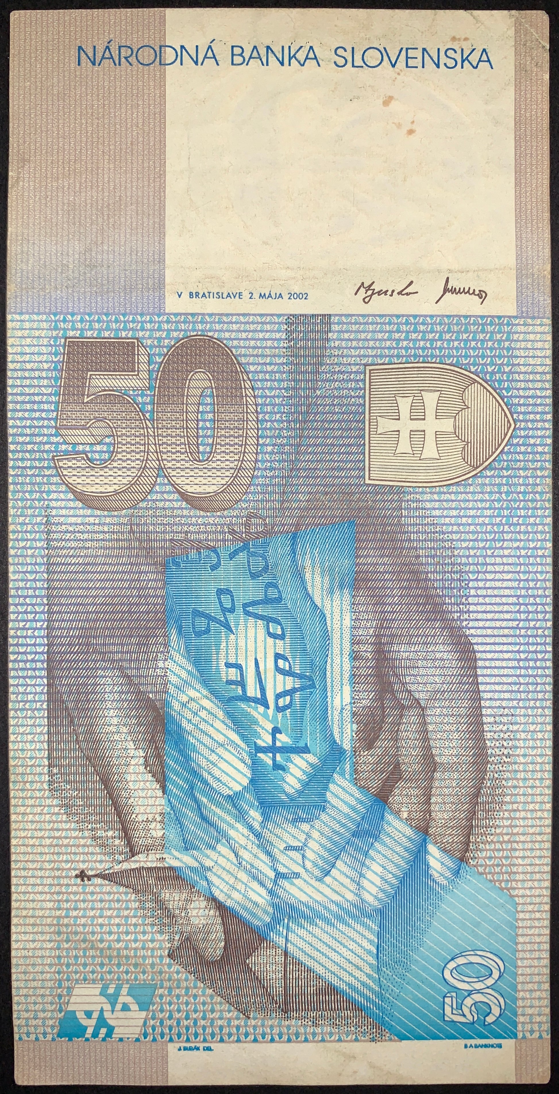 Reverse of the Slovak 50 korún note displaying religious symbolism and historical artwork associated with Saints Cyril and Methodius. Includes ornate patterns, denomination markings, and official National Bank of Slovakia design elements.