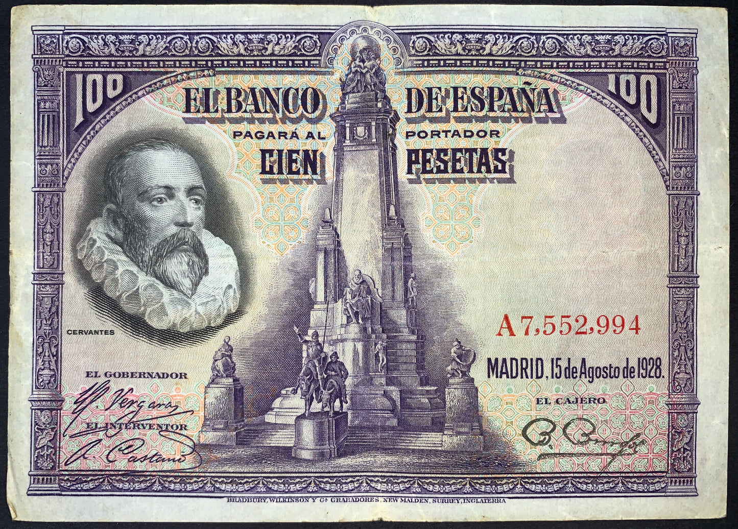 Spain 100 Pesetas banknote dated 15 August 1928 (P-76) featuring a portrait of Miguel de Cervantes alongside the Cervantes Monument in Madrid. Detailed purple engraving with ornate borders, serial numbers, and Banco de España inscriptions.