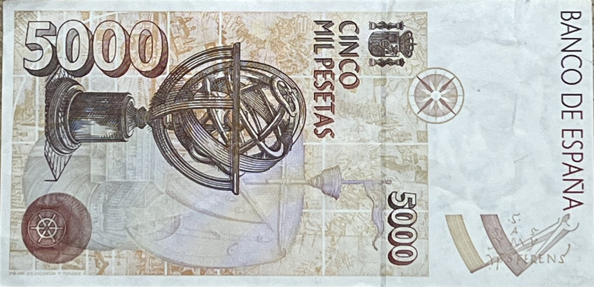 Back view of a 1992 Spain 5000 Pesetas banknote showing a detailed armillary sphere over a caravel with the Spanish coat of arms and a compass rose.