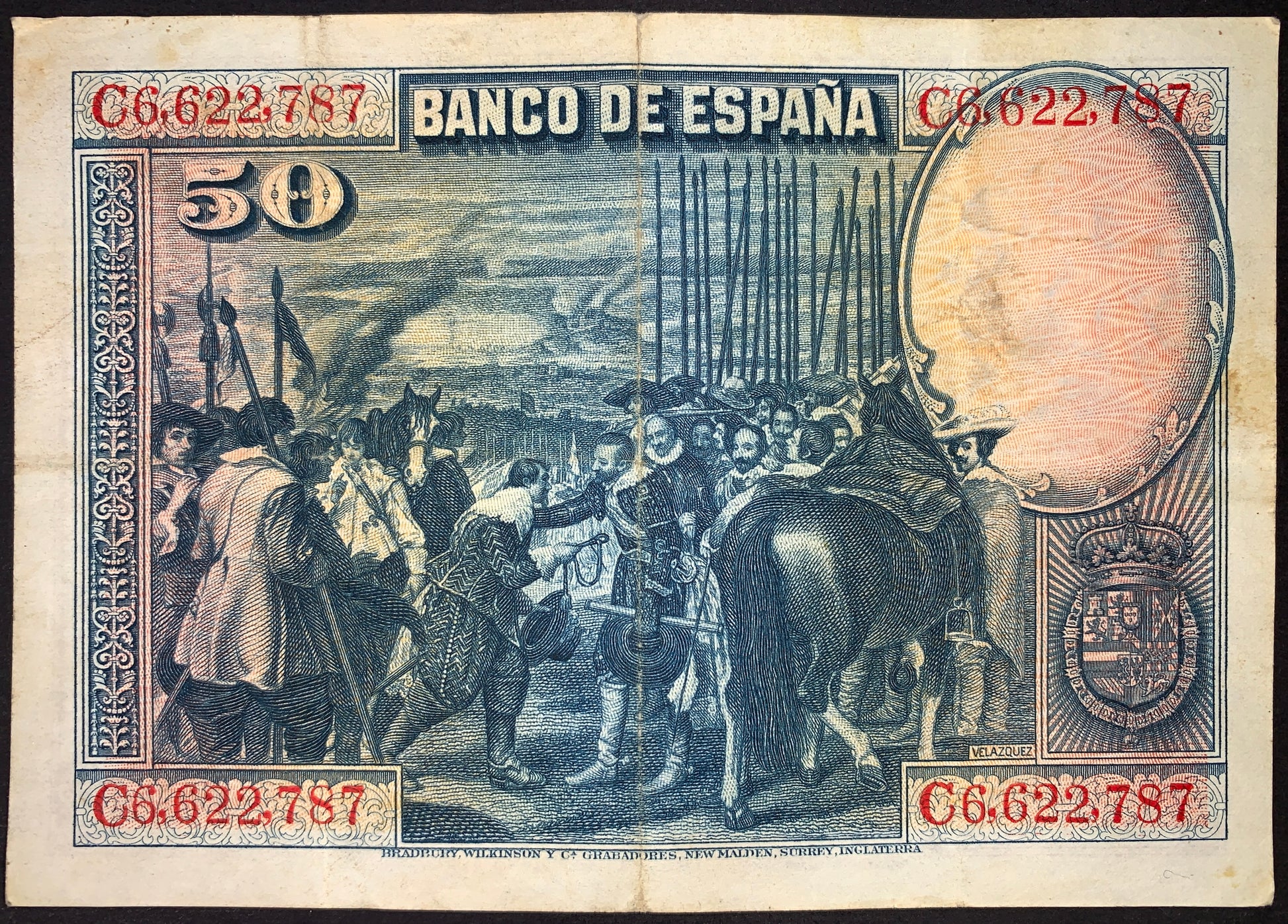 Reverse of Spain 50 Pesetas 1928 banknote (P-75) showing a historical military and diplomatic scene based on artwork associated with Velázquez. Finely engraved blue and red design featuring soldiers, horses, and period costumes.