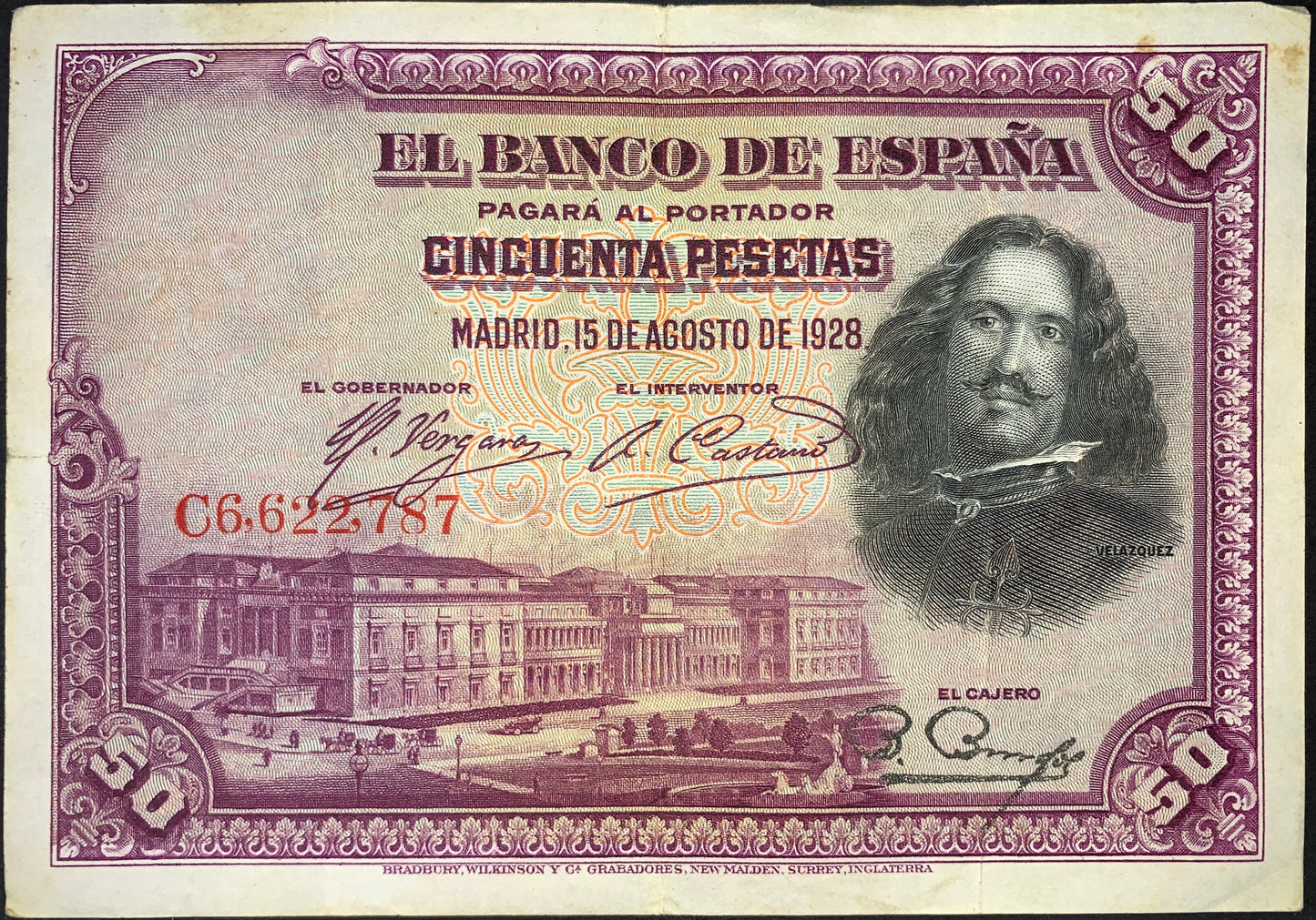 Spain 50 Pesetas banknote dated 15 August 1928 (P-75) featuring a portrait of Diego Velázquez, decorative engraved frame, Banco de España inscriptions, and architectural imagery. Historic Spanish banknote printed in rich purple tones with intricate security patterns.