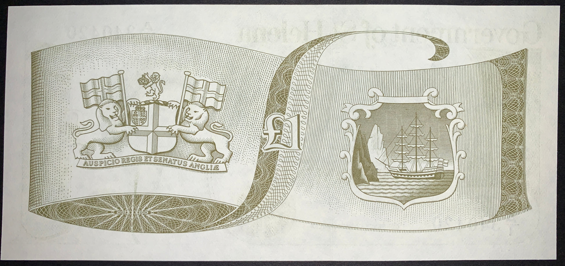 back of St. Helena 1 Pound ND (1981) P-9 AUNC featuring East India Company coat of arms and Colonial seal