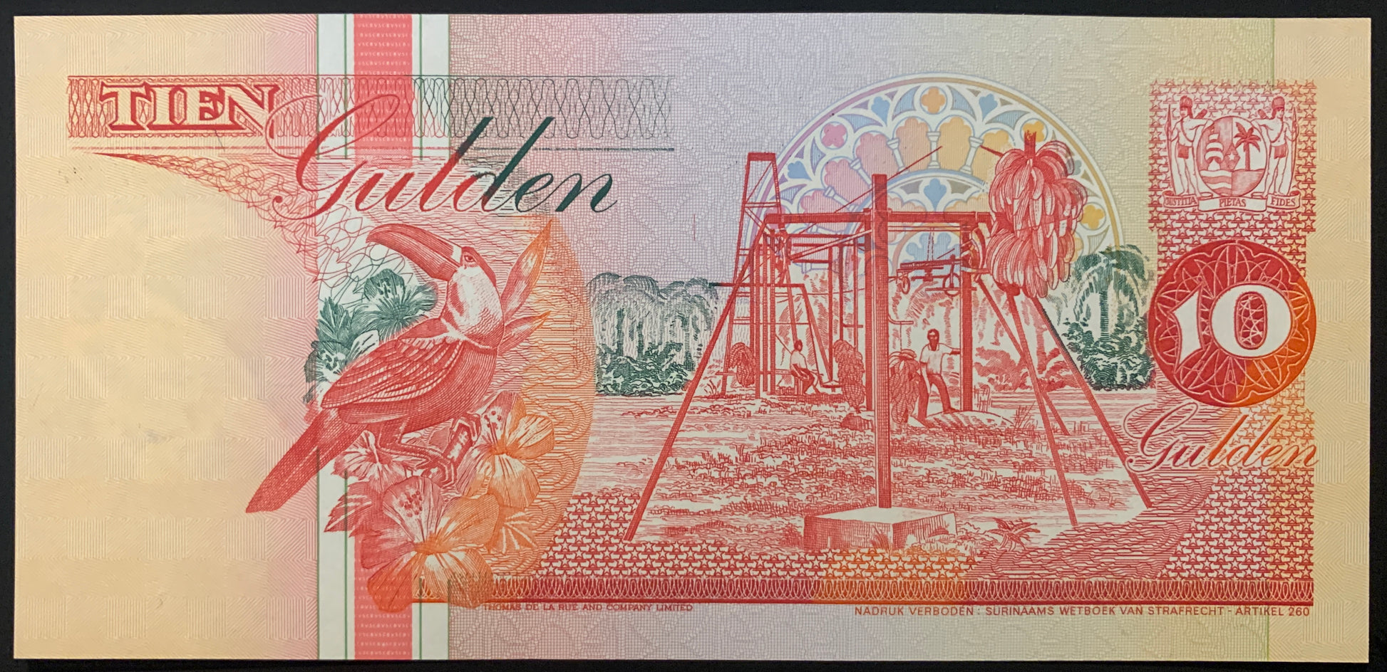 Suriname 10 Gulden 1998 P-137d UNC south american collectible banknote with toucan, flowers, and banana harvesting scene