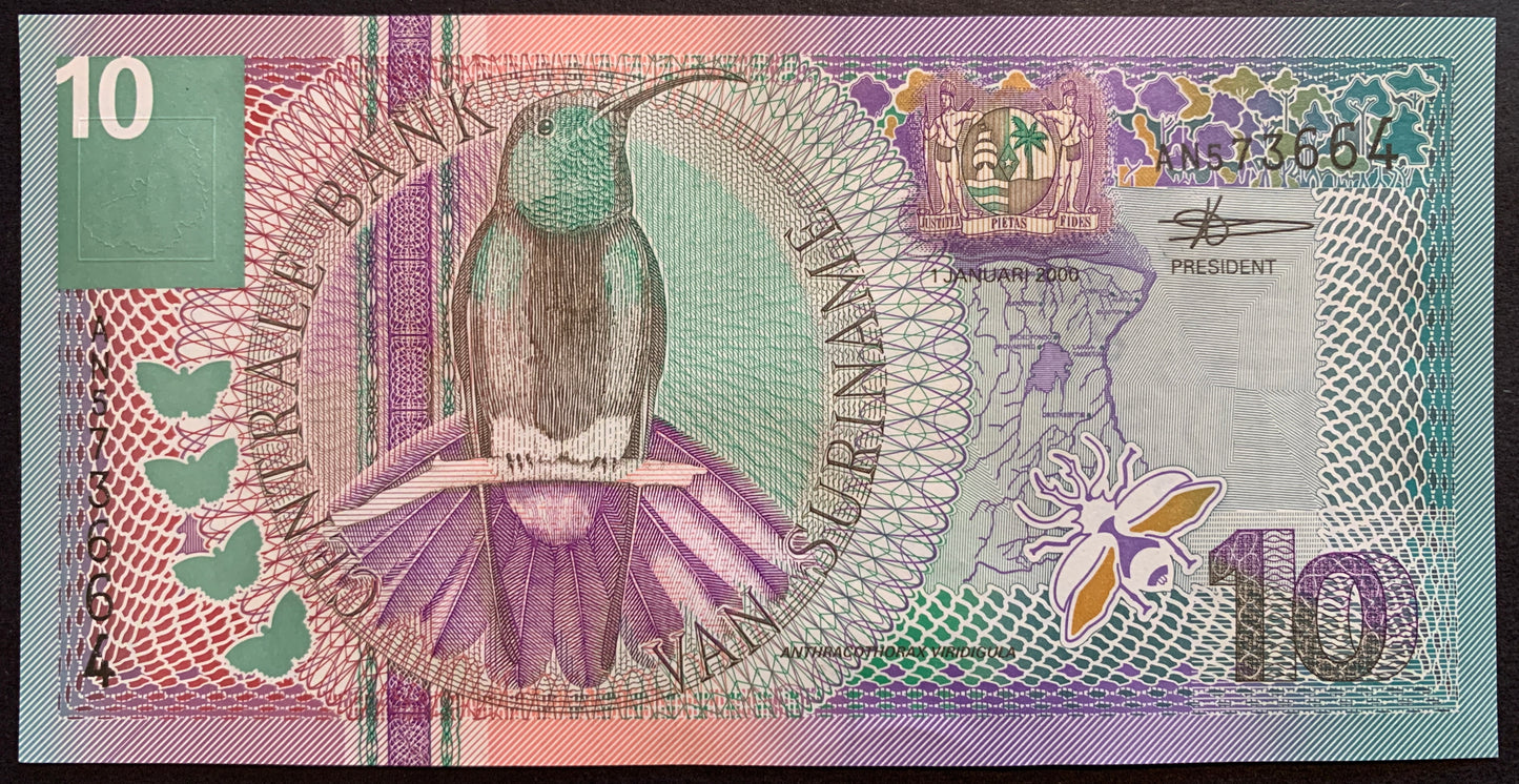 front of Suriname 10 Gulden 2000 P-147 collectible banknote with Black-throated mango