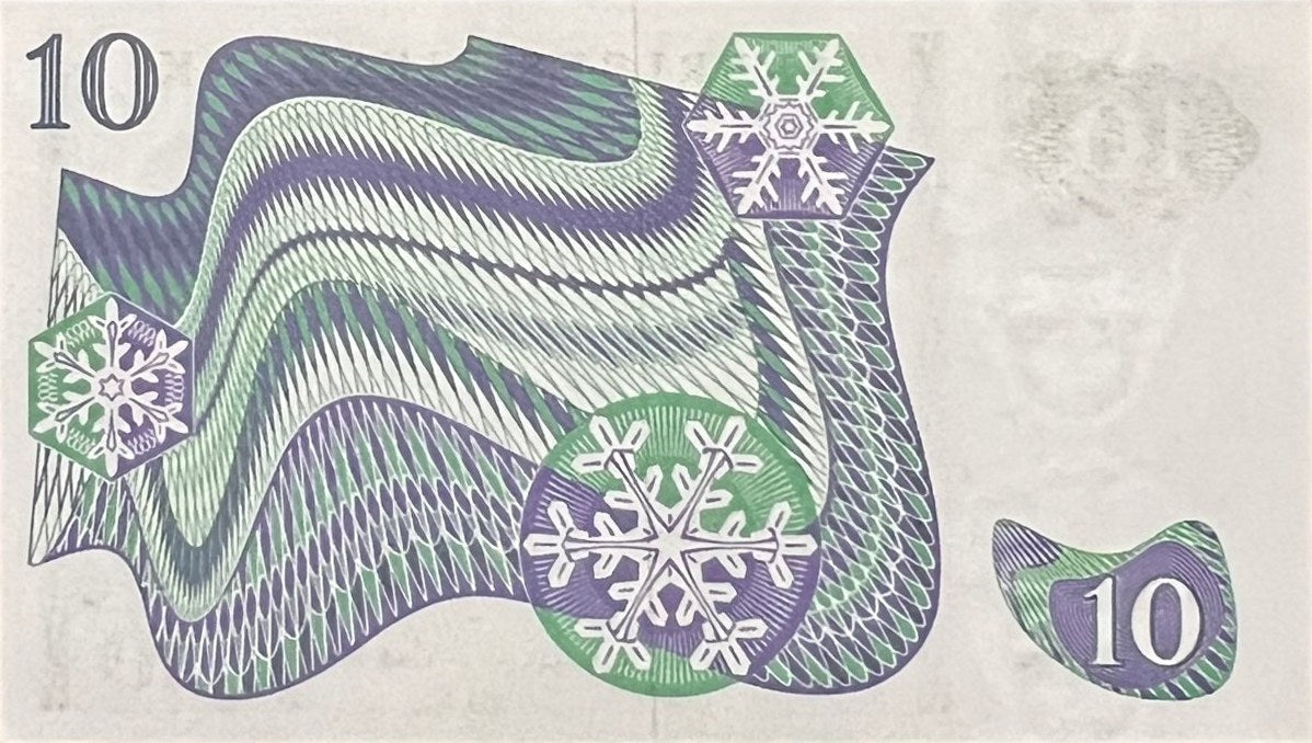 Back view of a 1972 Sweden 10 Kronor banknote showing the northern lights (aurora borealis) and snowflakes.