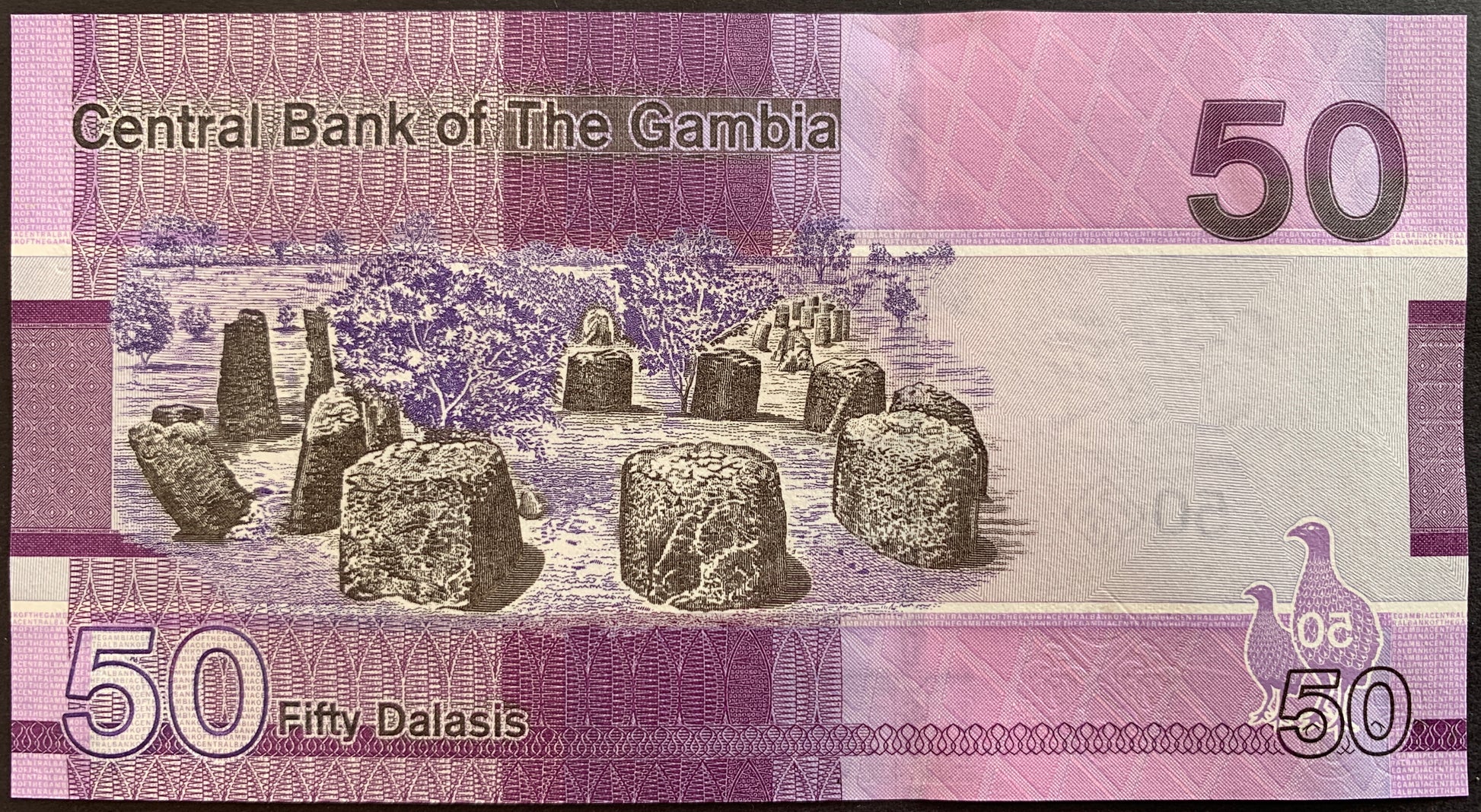 back of The Gambia 50 Dalasis 2023 collectible banknote with Wassu stone circles