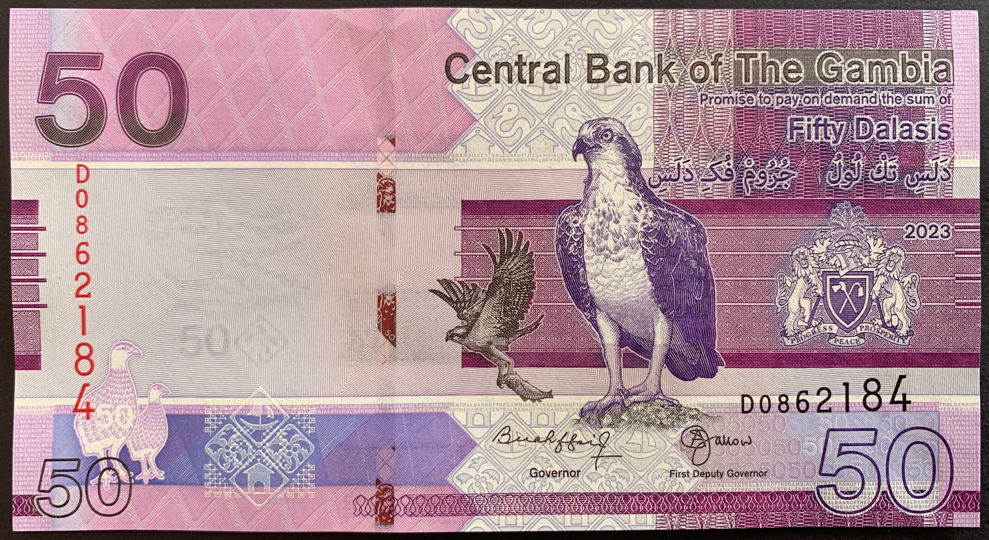 front of The Gambia 50 Dalasis 2023 collectible banknote with eagle and coat of arms