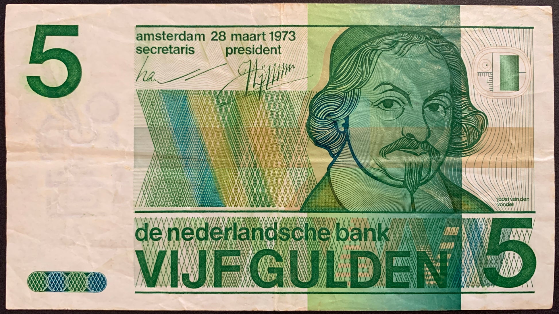 front of The Netherlands 5 Gulden 1973 P-95 collectible vintage banknote with portrait of Joost van den Vondel