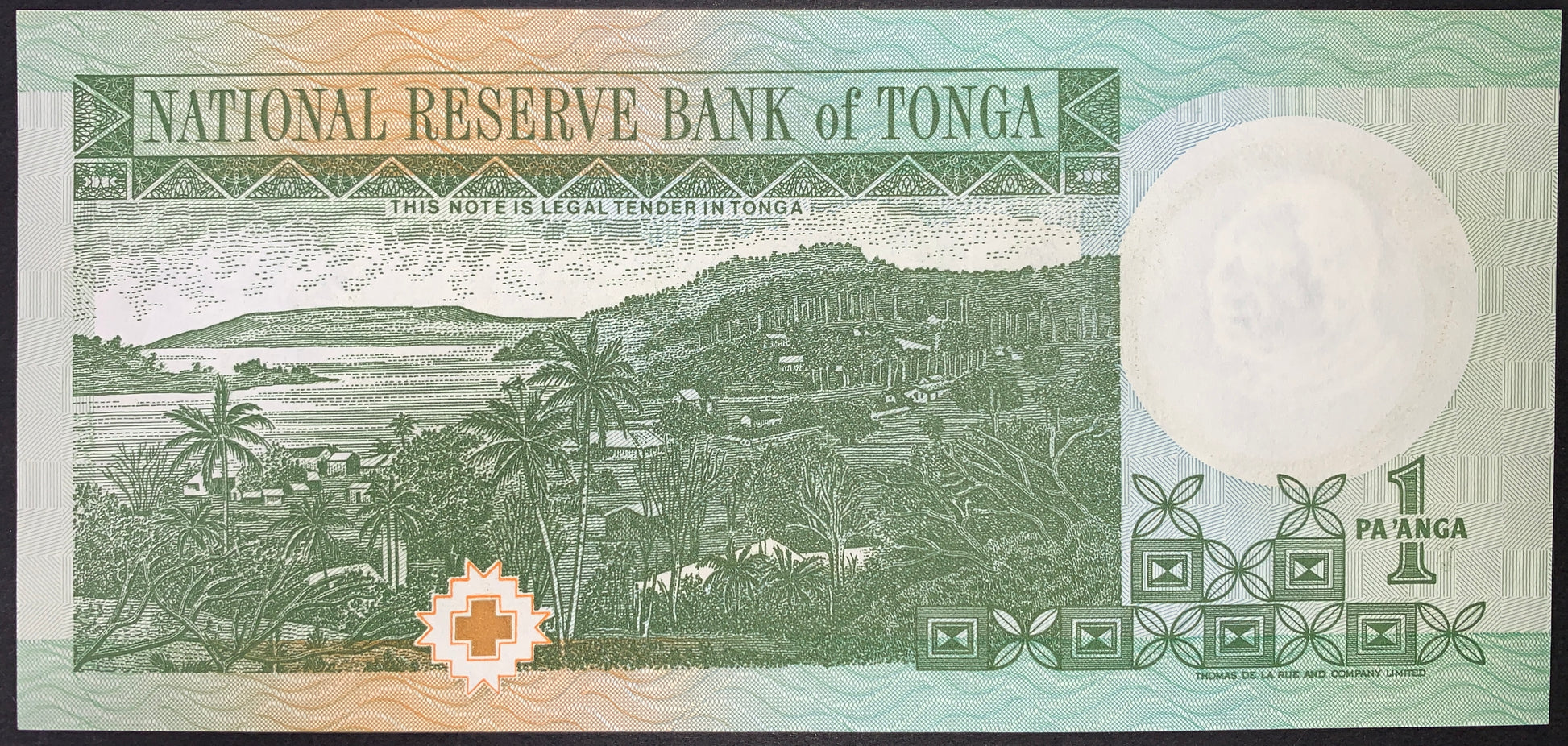 Reverse view of a green and light-teal Tonga 1 Pa'anga banknote in uncirculated condition. The main vignette displays a detailed panoramic landscape of Vavaʻu, featuring a coastal bay, rolling green hills, a rural hillside village, and tropical palm trees. The text "NATIONAL RESERVE BANK of TONGA" is printed in a green banner across the top. A large circular watermark area sits on the right side, above a bold "1 PA'ANGA" denomination marker and traditional Polynesian geometric tapa motifs lining the bottom 